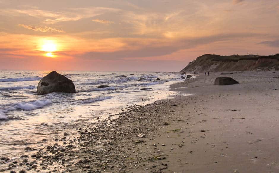 Sunset on a beach on Martha's Vineyard, a must-see on a Massachusetts road trip