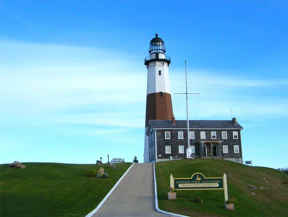 A lighthouse and building on top of a hill in Montauk, Long Island, New York