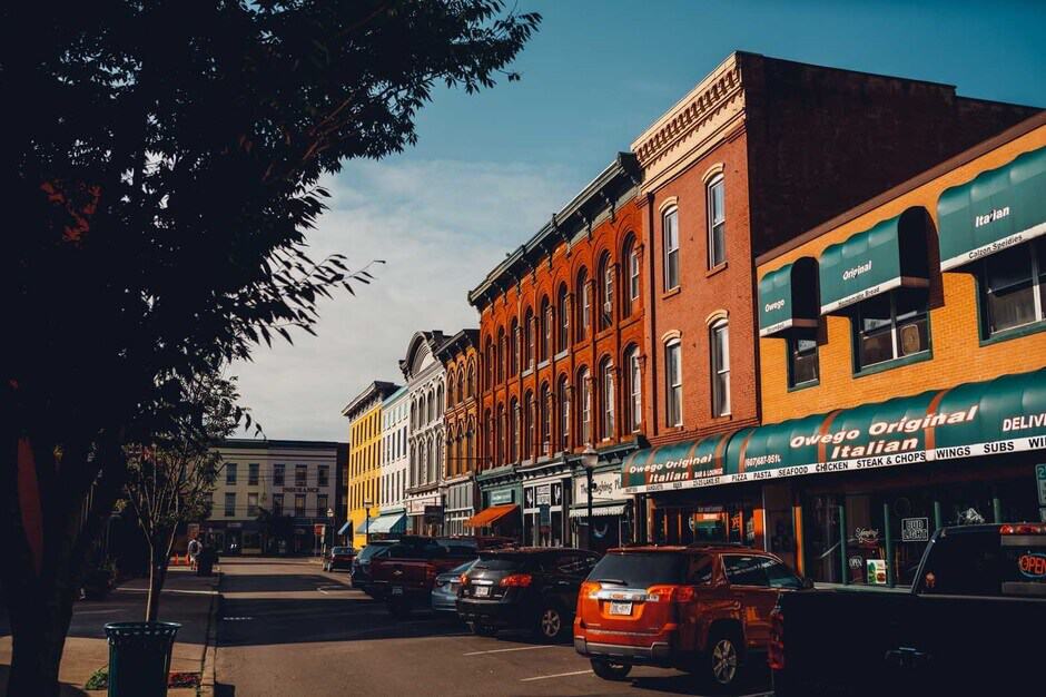 Quaint street with buildings and cars in Owego New York USA