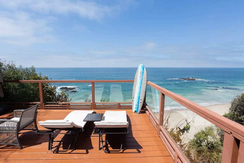 Deck with lounge chairs overlooking the Pacific ocean in California